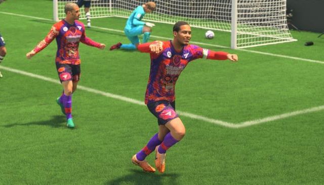 Virgil Van Dijk celebrates a goal with Antoine Griezmann behind him in EA Sports FC 24