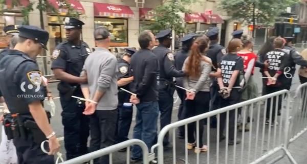 A total of 25 people were arrested by the early afternoon as demonstrators gathered on First Avenue near East 49th Street in Midtown East, authorities said.